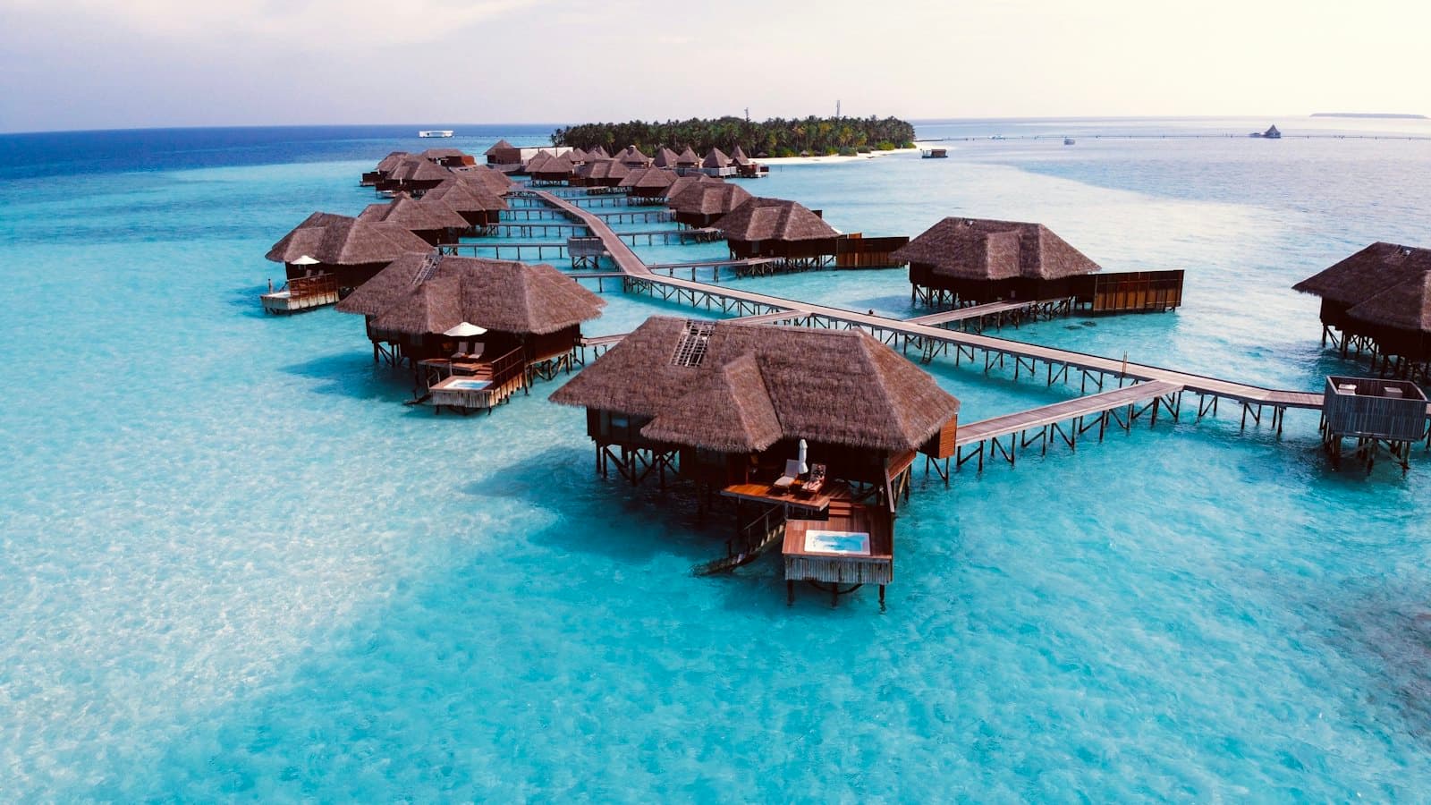Overwater villas above a turquoise Maldives lagoon