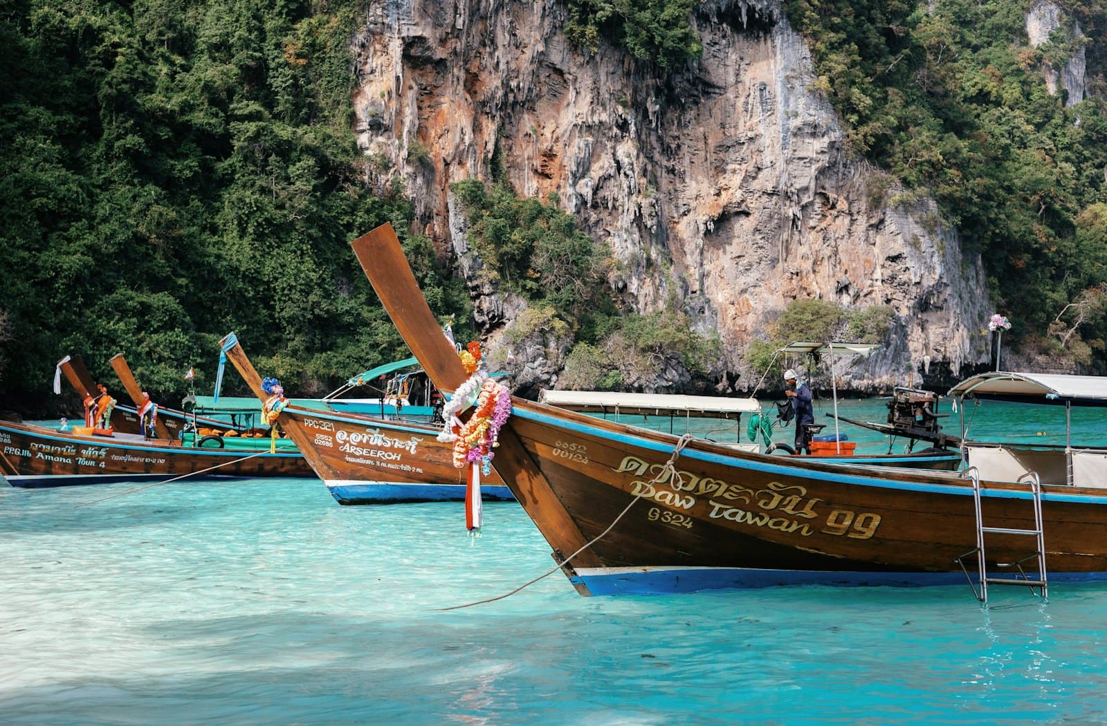 Longtail boats in turquoise water, Phuket